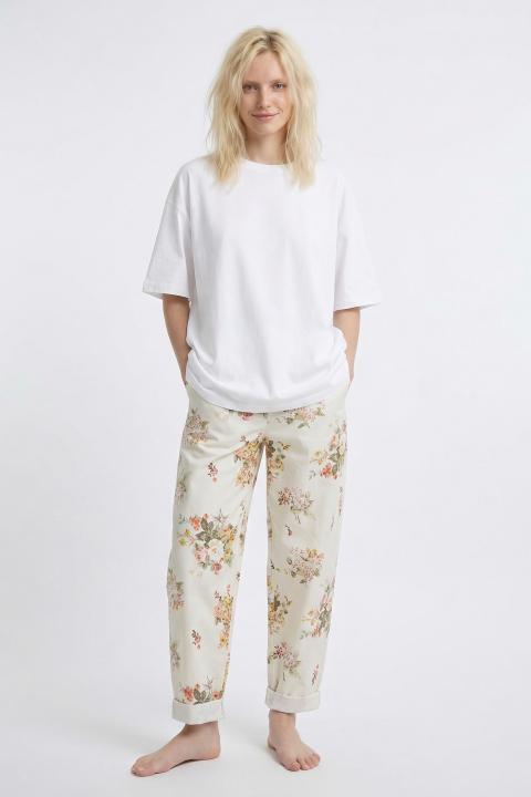 Pantalone carrot fiori arancio - Primavera Estate 2026 | Brend